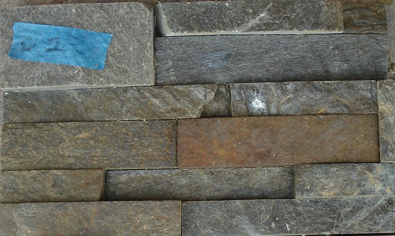 Norstone Charcoal Rock Panels that were tested with undiluted muriatic acid resulting in oxidation